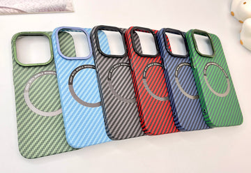 a group of four cell phones sitting on top of a table